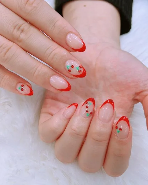 Red French tips with cherry art and gems on white fur