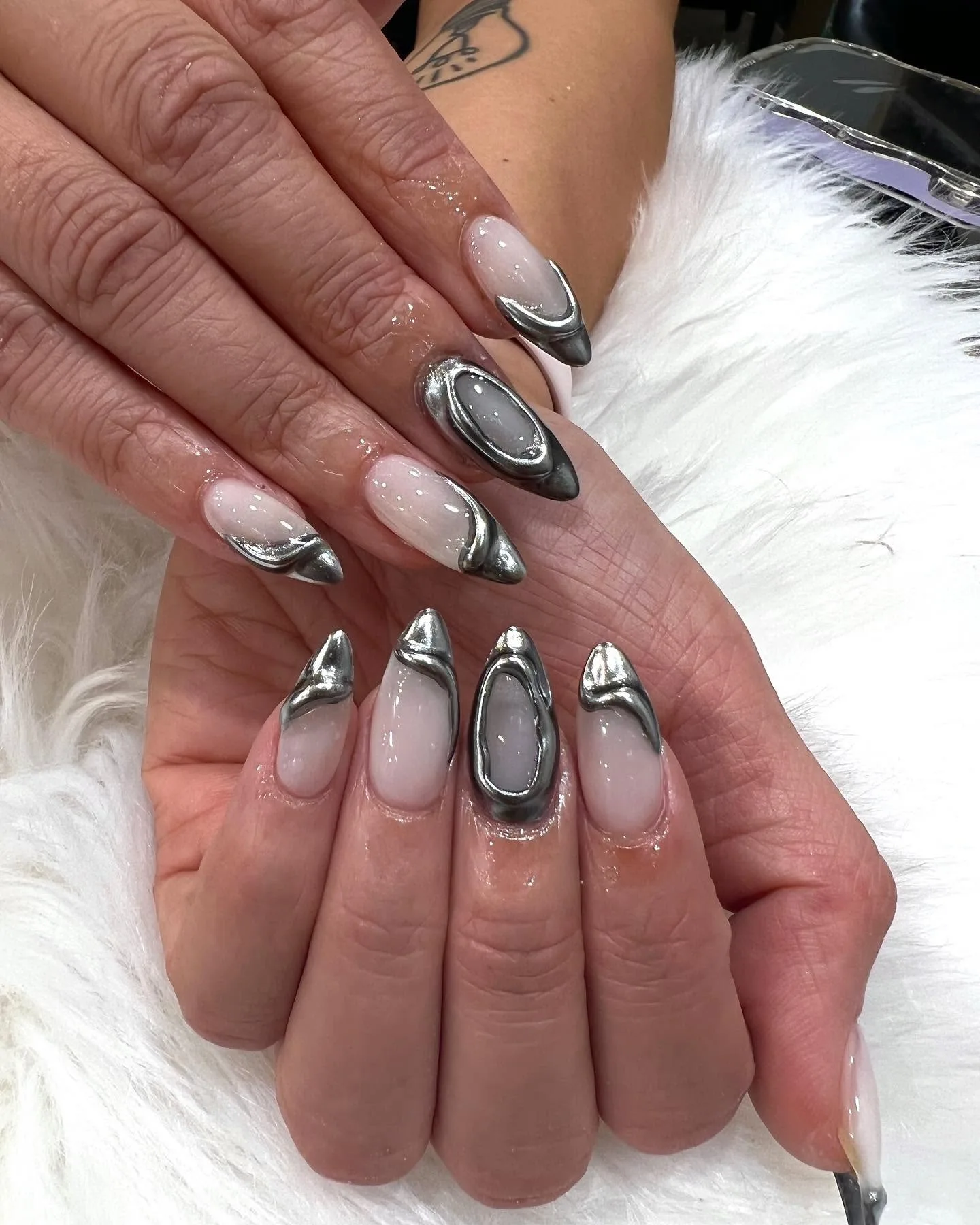 Molten liquid-silver chrome almond nails