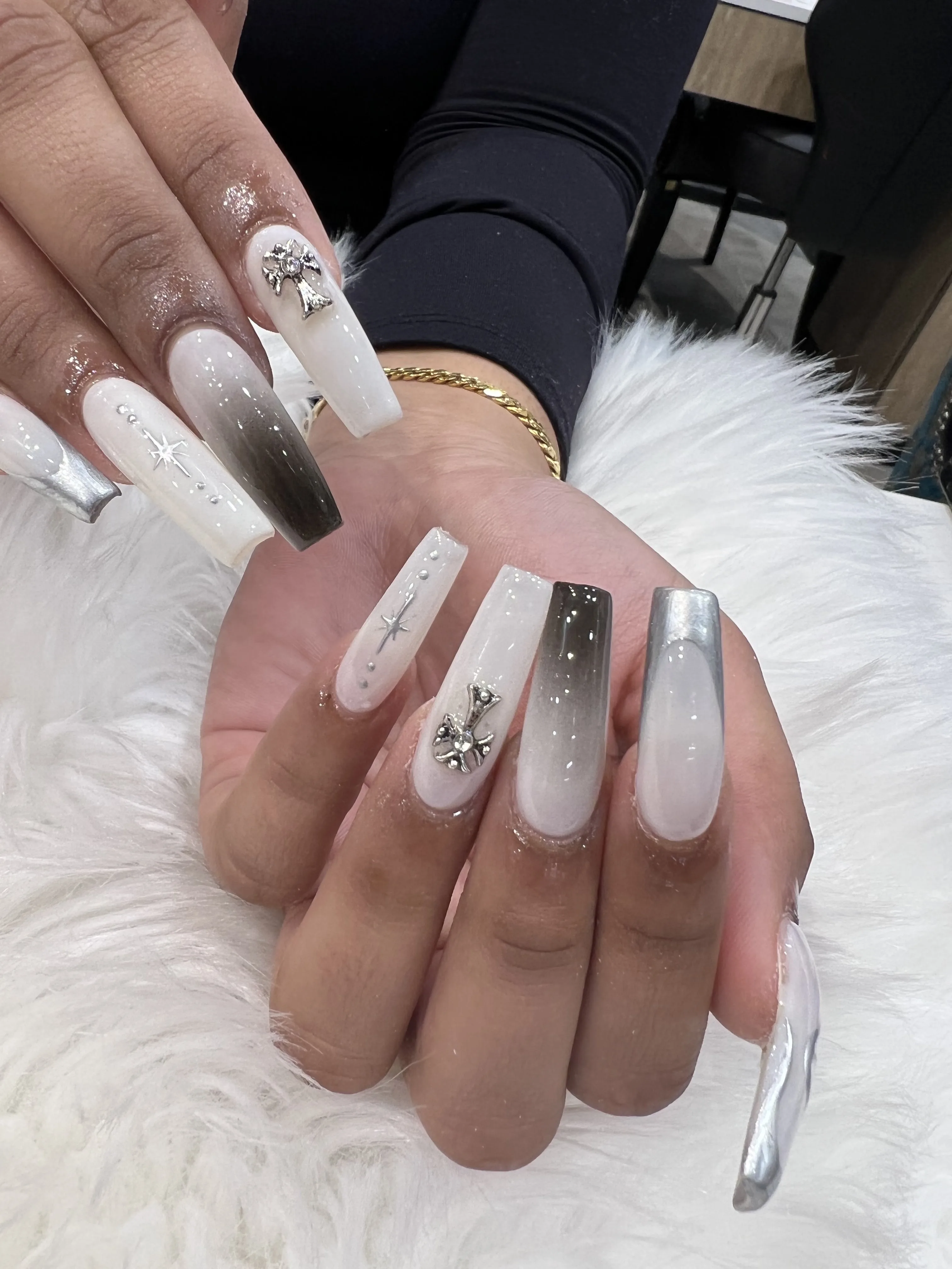 White and grey ombre coffin nails with silver chrome tips and 3D cross charms