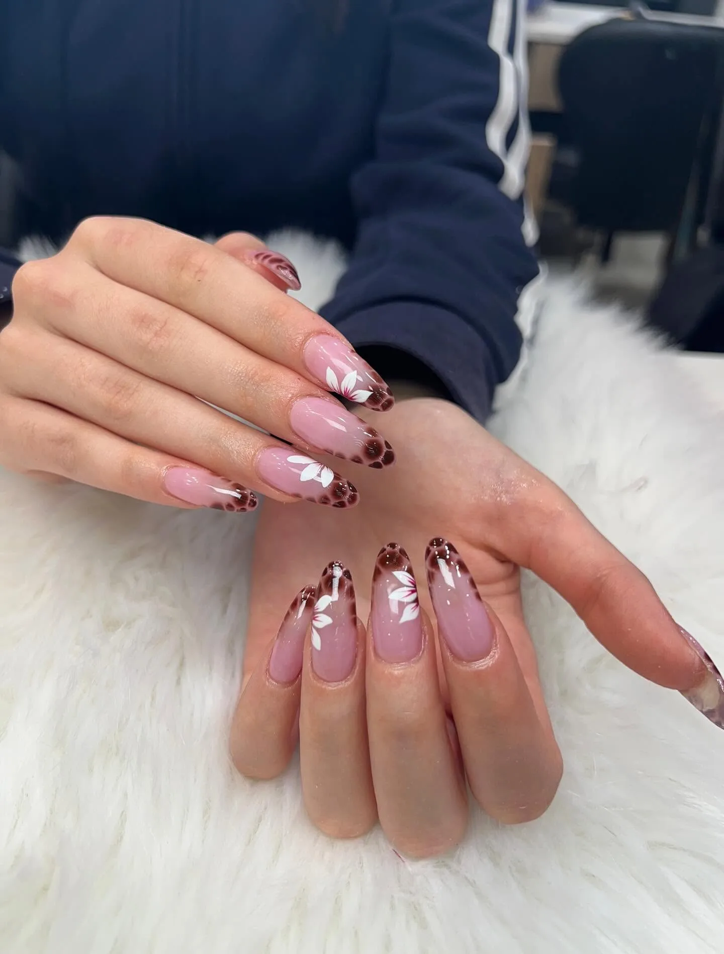 Pink and white 3D floral French tips on almond nails